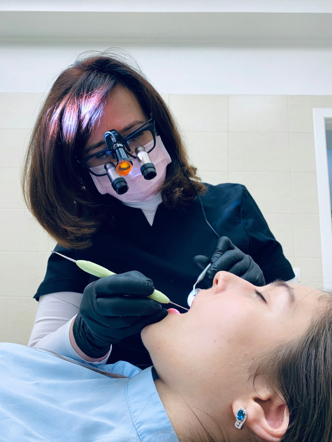 contact-img-02 woman-holding-medical-tool-on-persons-mouth-u2i16i-jc